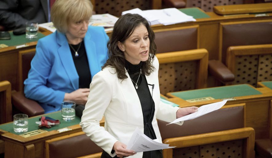 Co-chairman and parliamentary faction leader of LMP (Politics Can Be Different) green-liberal party, Bernadett Szel, speaks during the general debate regarding the proposed legislation on the transparency of foreign-funded NGOs at the parliament in Budapest, Hungary, Wednesday, April 19, 2017. (Szilard Koszticsak/MTI via AP)