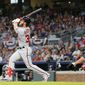 Washington Nationals&#39; Bryce Harper (34) watches his grand slam in front of Atlanta Braves catcher Anthony Recker (20) during the second inning of a baseball game Wednesday, April 19, 2017, in Atlanta. It was Harper&#39;s second homer of the game. (AP Photo/John Bazemore)