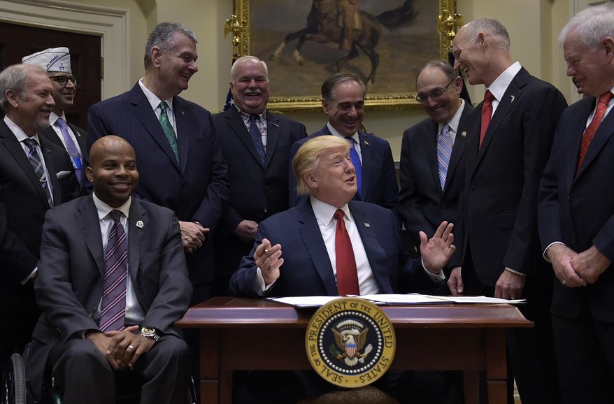 President Donald Trump talks about the Veterans Choice Program Extension and Improvement Act before signing it, Wednesday, April 19, 2017, in the Roosevelt Room of the White House in Washington. (AP Photo/Susan Walsh)