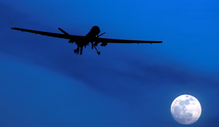 In this Jan. 31, 2010 file photo, an unmanned U.S. Predator drone flies over Kandahar Air Field, southern Afghanistan on a moonlit night. Today, when U.S. intelligence agencies believe they know the location of a terrorist in Pakistan and a few other countries, they are largely free to deploy a weapon that&#39;s become the symbol of war on terror: an aerial drone. The drone drops a bomb or fires a missile that executes the suspect. University of Utah law professor Amos Guiora is pushing for another step before the U.S. government or military could decide to kill a terror suspect with a drone. In a proposal to be published in 2015, Guiora and a colleague are pushing for what they call a &quot;drone court.&quot; The court would be part of the judiciary branch and hear arguments for why the United States should target a suspect with a drone strike. (AP Photo/Kirsty Wigglesworth, File)