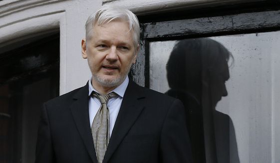 In this Feb. 5, 2016, file photo, WikiLeaks founder Julian Assange speaks from the balcony of the Ecuadorean Embassy in London. Two media reports say U.S. prosecutors are preparing or closely considering charges against the anti-secrecy group WikiLeaks, including  Assange, for revealing sensitive government secrets. (AP Photo/Kirsty Wigglesworth, File) **FILE**