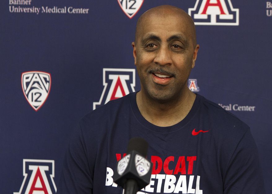 Lorenzo Romar answers questions during an NCAA college basketball press conference Thursday, April 20, 2017, at the University of Arizona in Tucson, Ariz. Romar, the former head men's basketball coach at the University of Washington, joined the staff of Arizona coach Sean Miller, who used to be one of his chief rivals. (Courtney Talak/Arizona Daily Star via AP)