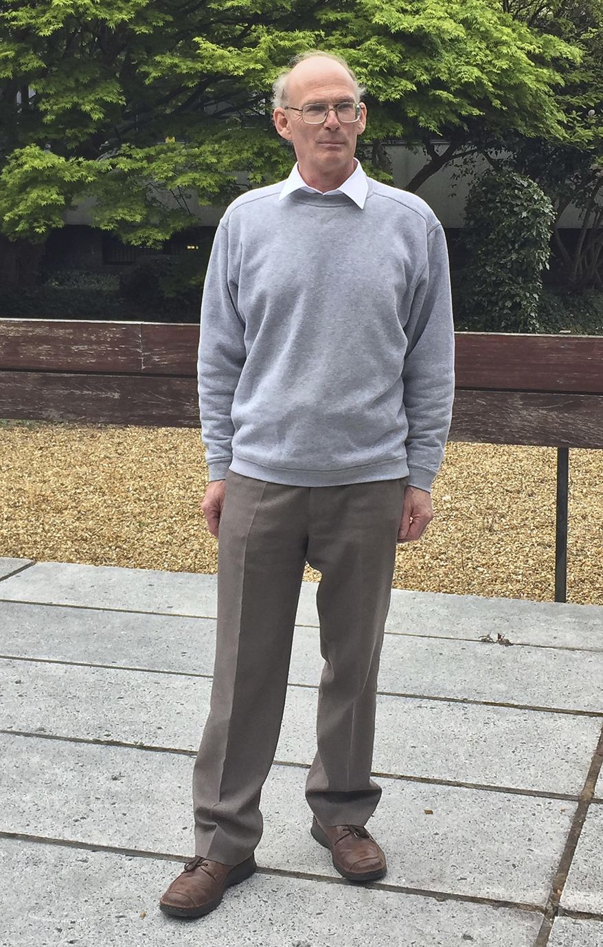 Piano tuner Martin Backhouse who found a stash of gold in a piano, is photographed in Shrewsbury England Thursday April 20, 2017. As a mystery surrounds the identity of the rightful heirs to a treasure trove of gold coins. British officials say they have been unable to trace the rightful heirs to a trove of gold coins worth a "life-changing" amount of money. The school that owns the piano and Backhouse the tuner who found the gold are now in line for a windfall after a coroner investigating the find declared it treasure. (Richard Vernalls/PA via AP)