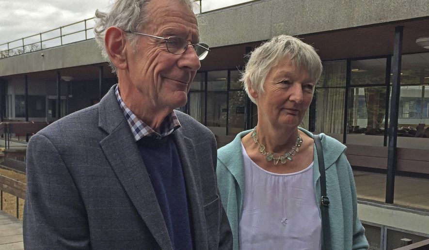 Graham and Meg Hemmings who previously owned a piano where a stash of gold was found are photographed in Shrewsbury England Thursday April 20, 2017. As a mystery surrounds the identity of the rightful heirs to a treasure trove of gold coins. British officials say they have been unable to trace the rightful heirs to a trove of gold coins worth a "life-changing" amount of money. The school that owns the piano and the tuner who found the gold are now in line for a windfall after a coroner investigating the find declared it treasure. (Richard Vernalls/PA via AP)