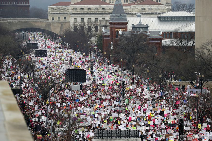 In this Jan. 21, 2017, file photo, a crowd fills Independence Avenue during the Women&#x27;s March on Washington, in Washington. The major protests in Washington that have greeted President Donald Trump’s first year in office are set to return in force, continuing an already expensive year for city officials who work to keep people safe during mass gatherings. (AP Photo/Alex Brandon, File)