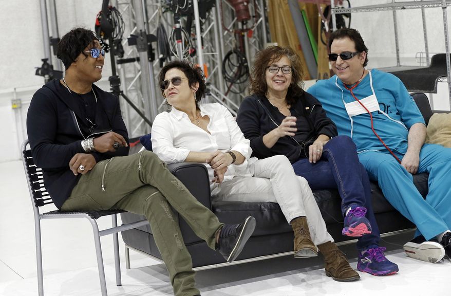 Four original members of Prince's 1980's band, The Revolution, appear before an interview Wednesday, April 19, 2017, in Minneapolis. The group, from left: bassist BrownMark, Guitarist Wendy Melvoin, keyboarders Lisa Coleman and Matt Fink, is preparing to kick off a spring U.S. tour with a performance Friday, the first anniversary of the Prince's death from an accidental painkiller overdose. (AP Photo/Jim Mone)