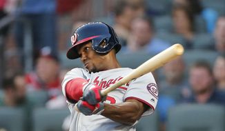 Washington Nationals outfielder Michael Taylor drives in a run with a sacrifice fly during the second inning of a baseball game against the Atlanta Braves on Thursday, April 20, 2017, in Atlanta. (AP Photo/John Bazemore) ** FILE **