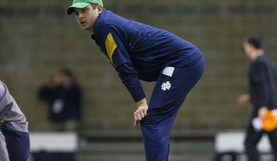 Notre Dame quarterbacks coach Tommy Rees watches during practice at the Loftus Sports Center in South Bend, Ind., Saturday, March 24, 2017. Being in the spotight was not always enjoyable when he was a player.(Michael Caterina/South Bend Tribune via AP)