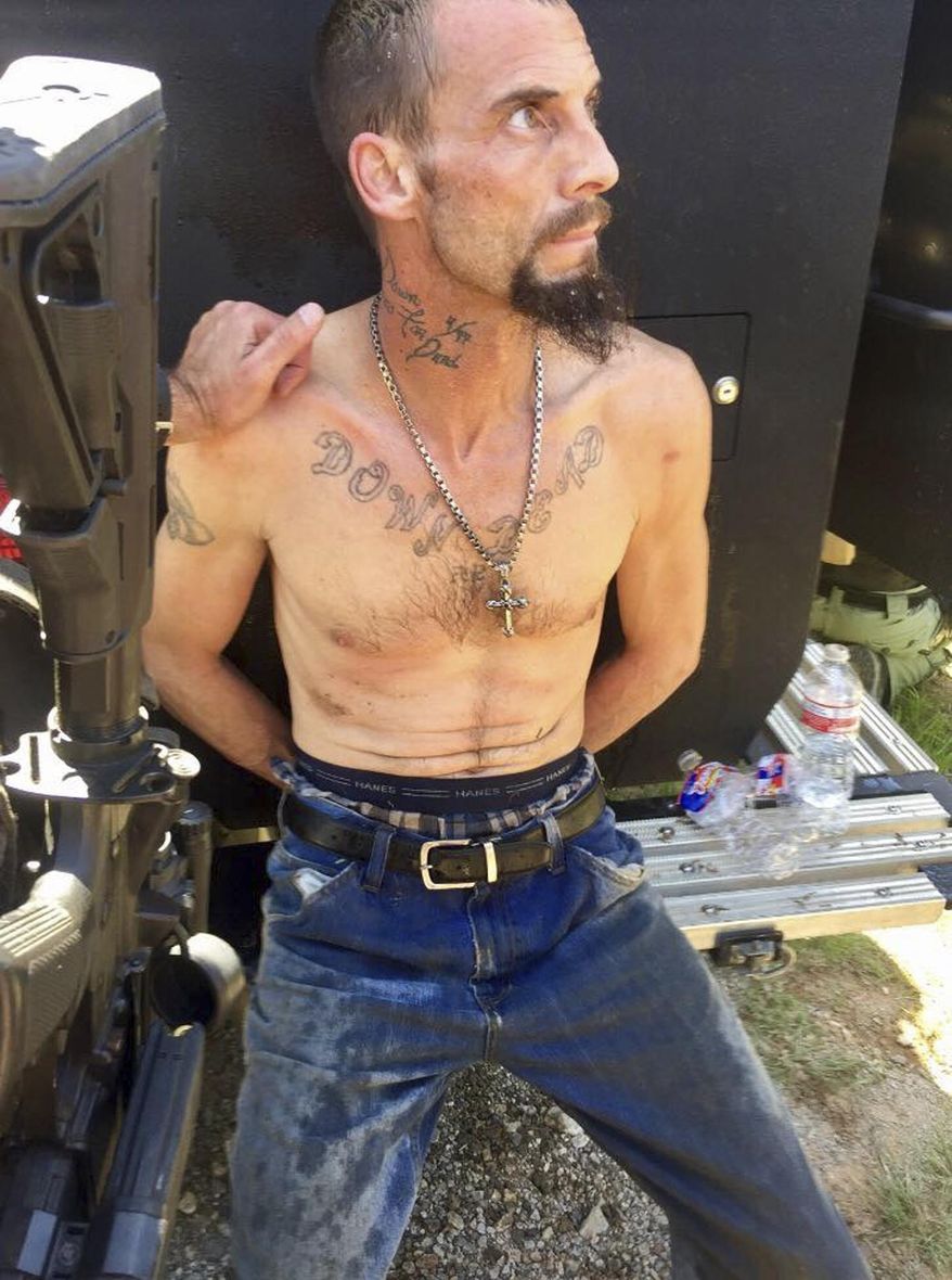 In this photo provided by the Oklahoma County Sheriff's Office, Nathan Aaron LeForce is pictured after his arrest near Guthrie, Okla., Tuesday, April 18, 2017. LeForce is the suspect in the Tuesday, April 18, 2017 fatal shooting of Logan County Sheriff's Deputy David Wade. (Oklahoma County Sheriff's Office via AP)