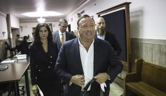 In this Monday, April 17, 2017, photo, &amp;quot;Infowars&amp;quot; host Alex Jones arrives at the Travis County Courthouse in Austin, Texas. (Tamir Kalifa/Austin American-Statesman via AP)