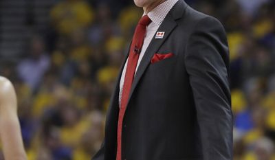 Portland Trail Blazers coach Terry Stotts argues a call during the first half in Game 2 of the team's first-round NBA basketball playoff series against the Golden State Warriors Wednesday, April 19, 2017, in Oakland, Calif. (AP Photo/Marcio Jose Sanchez)