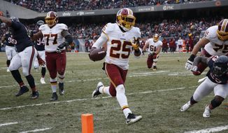 FILE - In this Dec. 24, 2016 file photo, Washington Redskins running back Chris Thompson (25) scores a touchdown against the Chicago Bears during the first half of an NFL football game in Chicago. The Redskins announced Friday, April 21, 2017, they have re-signed the restricted free agent. (AP Photo/Nam Y. Huh, File)