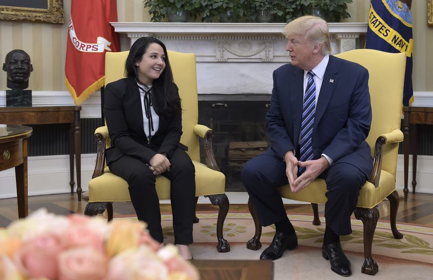 President Donald Trump meets with Aya Hijazi, an Egyptian-American aid worker, in the Oval office of the White House in Washington, Friday, April 21, 2017. Hijazi, an Egyptian-American charity worker was freed after nearly three years of detention in Egypt returning to the U.S., Thursday, April 20, 2017. (AP Photo/Susan Walsh)