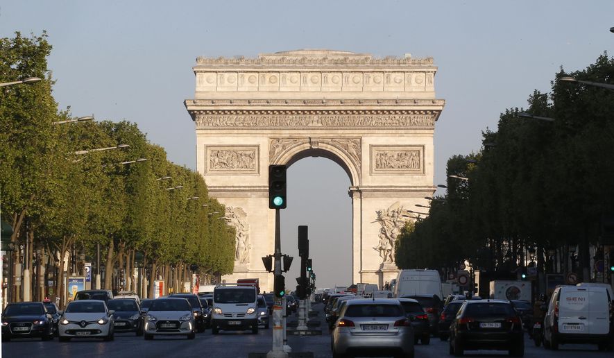 The Arc de Triomphe is pictured on the Champs Elysees boulevard in Paris, early Friday, April 21, 2017. (AP Photo/Michel Euler) ** FILE **
