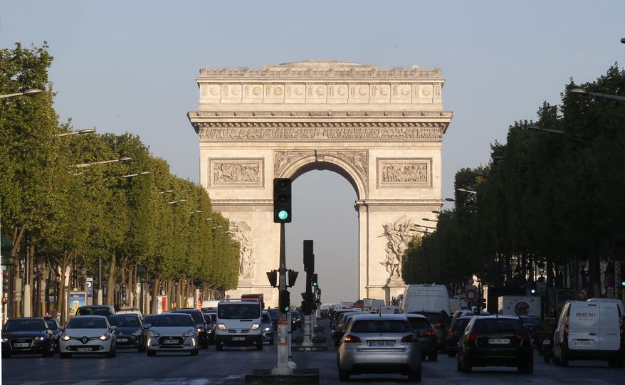 The Arc de Triomphe is pictured on the Champs Elysees boulevard in Paris, early Friday, April 21, 2017. (AP Photo/Michel Euler) ** FILE **
