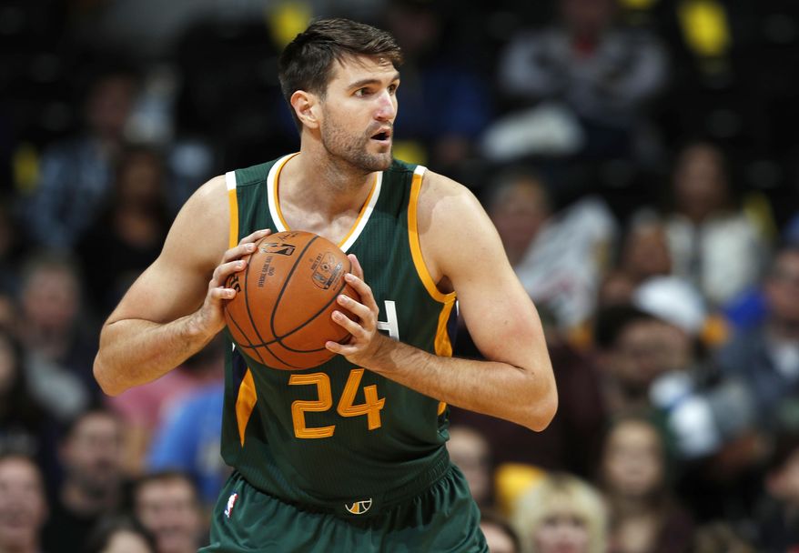 FILE - In this Nov. 20, 2016, file photo, Utah Jazz center Jeff Withey looks to pass in the first half of an NBA basketball game against the Denver Nuggets in Denver. Manhattan Beach, Calif., police spokesman Sgt. Tim Zins said Thursday, April 20, 2017, that a police report had been filed accusing Withey of domestic violence and detectives are looking into it. The Jazz said in a statement that the team is aware of the allegations against Withey but would not comment until they had a better understanding of the situation. (AP Photo/David Zalubowski, File)