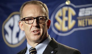 FILE - In this March 13, 2015, file photo, Southeastern Conference Commissioner Greg Sankey speaks before an NCAA college basketball game in Nashville, Tenn. Sankey has denied a request seeking his removal as head of the NCAA infractions panel handling North Carolina’s ongoing academic case because of a conflict of interest. Sankey stated in an April 14 letter obtained by The Associated Press that the panel would “fairly decide this case.” UNC faces five top-level charges, including lack of institutional control, in the multiyear probe centered on irregular courses in an academic department.(AP Photo/Mark Humphrey, File)