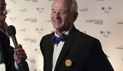 FILE - In this Oct. 23, 2016, file photo, Bill Murray arrives at the Kennedy Center for the Performing Arts for the 19th Annual Mark Twain Prize for American Humor presented to Bill Murray in Washington. The New York Times reported on April 19, 2017, that Murray is set to go on tour with a chamber music trio for a program of songs and literary readings.(Photo by Owen Sweeney/Invision/AP, File)