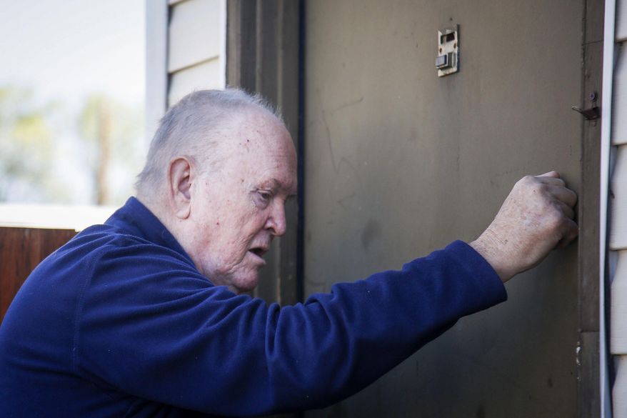 In this Thursday, April 13, 2017 photo, Don Ward, a retired high school history teacher, knocks on the door of an apartment in the South Parc Apartments to hand out Easter baskets to refugees in South Salt Lake, Utah. When the LDS Church launched its "I Was a Stranger" initiative last year, Ward couldn't help but smile because people were suddenly motivated and wanted to get involved. The Deseret News reported people were unaware that there are 60,000 refugees in Utah. Ward estimated that he and others have helped more than 20,000 refugees in Salt Lake County over the past eight years. (Nicole Boliaux/The Deseret News via AP)