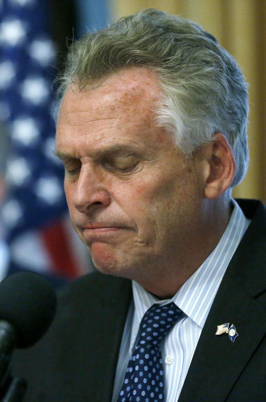 Virginia Gov. Terry McAuliffe pauses after stating that he will not pardon Ivan Teleguz, who is on death row on a murder for hire conviction, but will commute his sentence from the death penalty to life without parole, during a press conference at the State Capitol in Richmond, Va. Thursday, April 20, 2017. (Bob Brown/Richmond Times-Dispatch via AP)