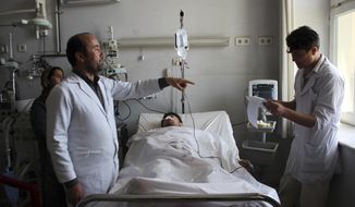 An injured soldier recovers in a hospital after Friday&#39;s attack at a military compound in Mazar-e-Sharif province north of Kabul, Afghanistan, Saturday, April 22, 2017.  Gunmen wearing army uniforms stormed a military compound in the Balkh province, killing at least eight soldiers and wounding 11 others, an Afghan government official said Friday. (AP Photo)