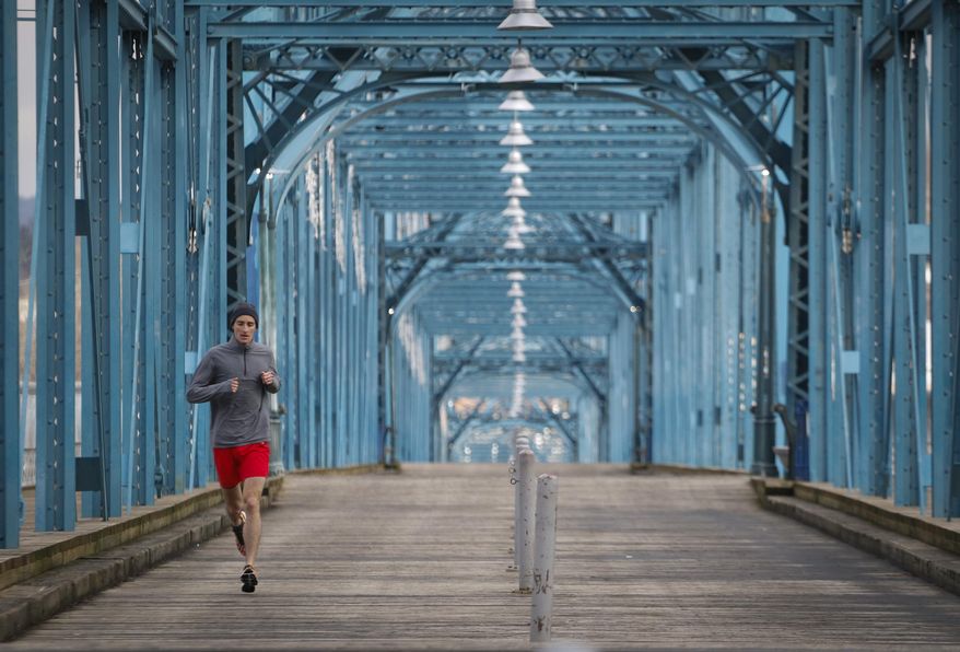 Nathan Sexton, 29, head of the Business Intelligence department for Bellhops, goes on a 5k lunch training run on Thursday, February 25, 2016. Sexton was eight and a half months into a fight with brain cancer. He went on to run in the Boston Marathon. (Dan Henry/Chattanooga Times Free Press via AP)