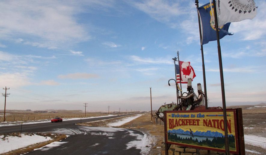 FILE - This Dec. 12, 2012 file photo shows a sign welcoming visitors to the Blackfeet Indian reservation in Browning, Mont. Montana might be known internationally for such recreational jewels as Glacier and Yellowstone national parks, but Native Americans say the state is losing an opportunity by failing to develop and promote its vast tribal lands as tourist destinations. (AP Photo/Matt Volz, File)