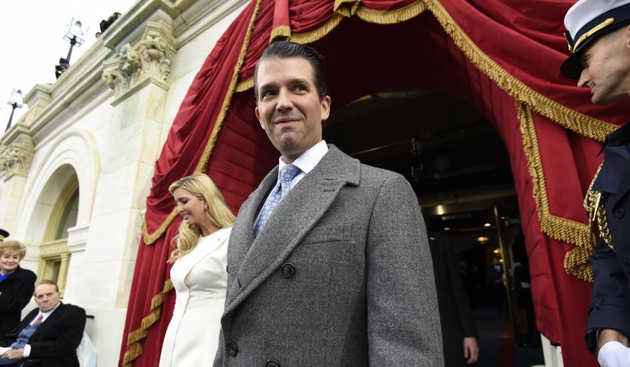 In this Jan. 20, 2017, file photo, Donald Trump, Jr., and his sister, Ivanka Trump arrive on Capitol Hill in Washington for the presidential Inauguration of their father, Donald Trump. (Saul Loeb via AP, Pool, File)