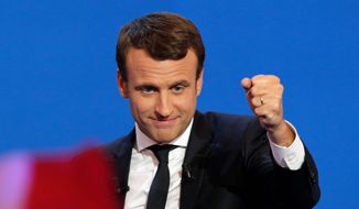 French centrist presidential candidate Emmanuel Macron, addressing cheering supporters in Paris on Sunday, told them they are &quot;the faces of French hope&quot; and vowed to be a president &quot;who protects, who transforms and builds.&quot; The centrist ex-banker who set up his party just a year ago garnered the most votes. (Associated Press)