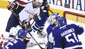 Washington Capitals centre Marcus Johansson (90) scores against the Toronto Maple Leafs during the third period of Game 6 of an NHL hockey Stanley Cup first-round playoff series in Toronto on Sunday, April 23, 2017. (Frank Gunn/The Canadian Press via AP)