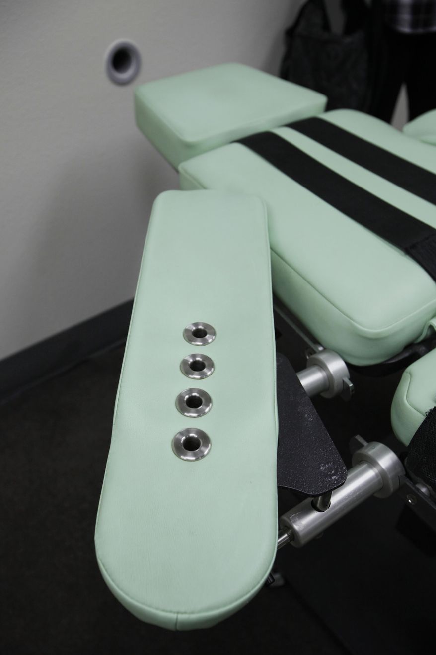 FILE - This Sept. 21, 2010 file photo shows an armrest in the interior of the lethal injection facility at San Quentin State Prison in San Quentin, Calif. California corrections officials expect to meet a Wednesday, April 26, 2017, deadline to submit revised lethal injection rules to state regulators, trying again with technical changes after the first attempt was rejected in December. While California has long been what one expert calls "a symbolic death penalty state," the nation's most populous state may now be easing back toward allowing executions. (AP Photo/Eric Risberg, File)