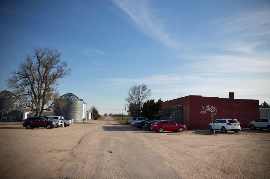 ADVANCE FOR USE SUNDAY, APRIL 23 - In this April 7, 2017 photo, cars sit in the parking lot of the The Speakeasy restaurant in Sacramento, Neb. . Ryan Puls says he never imagined himself as a chef or running The Speakeasy steakhouse, but he has transformed the former rural steakhouse into a fine dining establishment. (Megan Farmer/Omaha World-Herald via AP)