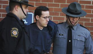 FILE - In this Jan. 5, 2015, file photo, Eric Frein is led away by Pennsylvania State Police Troopers at the Pike County Courthouse after his preliminary hearing in Milford, Pa. Prosecutors are seeking the death penalty against Frein, who they said targeted state police because he was trying to foment an uprising against the government. Frein’s lawyers want the jury to sentence him to life without parole. (Butch Comegys/The Times &amp;amp; Tribune via AP, File)