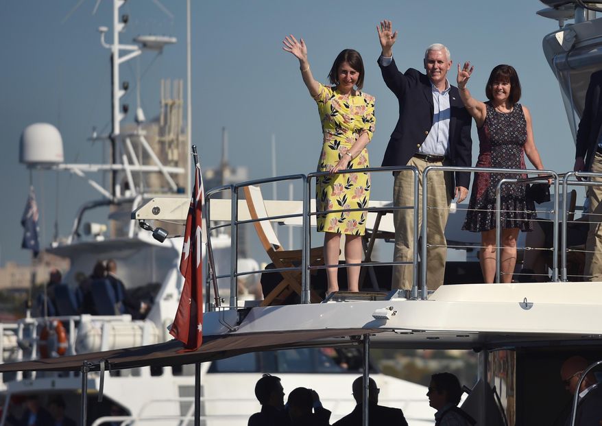 U.S. Vice President Mike Pence, center, his wife Karen, right, and New South Wales Premier Gladys Berejiklian wave during a cruise on the harbor in Sydney, Sunday, April 23, 2017. Pence is on the last part of his four-country trip to Asia and Australia. (Peter Parks/Pool via AP)