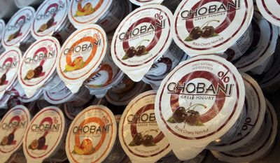 FILE- In this July 23, 2012, file photo, containers of Chobani yogurt are shown at the Chobani yogurt bar in the Soho neighborhood of New York. Chobani is suing right-wing radio host Alex Jones, accusing the conspiracy theorist of publishing false information about the company. Chobani filed the lawsuit Monday, April 24, 2017. (AP Photo/Mary Altaffer, file)