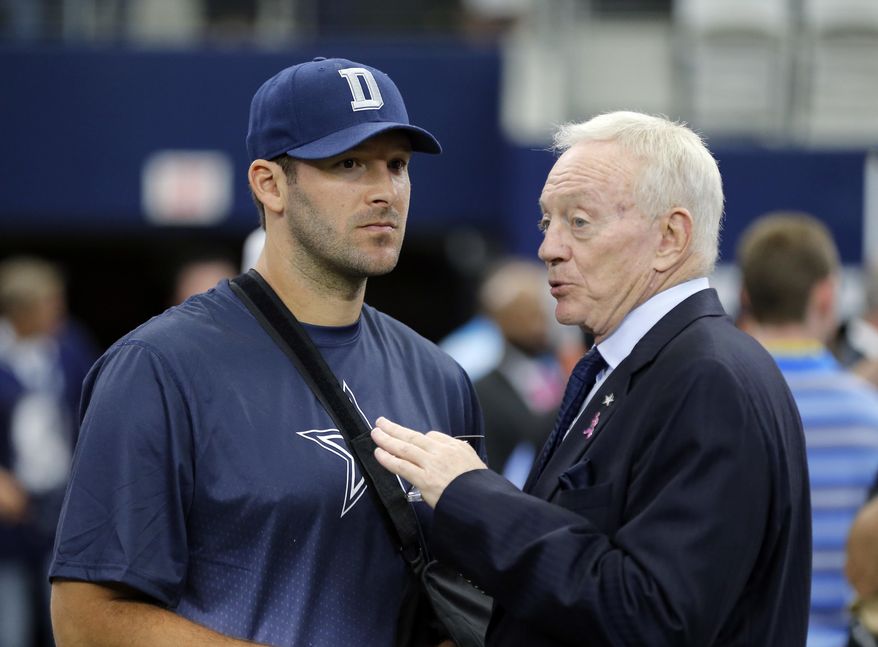 This Oct. 11, 2015 photo shows Dallas Cowboys owner Jerry Jones, right, talking with quarterback Tony Romo before an NFL football game against the New England Patriots in Arlington, Texas. Oct. 11, 2015. Jones honored DeMarcus Ware with the announcement that the franchise sacks leader would retire as a Cowboy, then engaged in a draft discussion centered largely on finding the team’s next dominant pass rusher. It’s exactly the opposite with Tony Romo, since the Cowboys have yet to pay homage to their 10-year starting quarterback as he heads to the broadcast booth while Dallas prepares for the start of the NFL draft feeling secure in the future under center. (AP Photo/Brandon Wade)