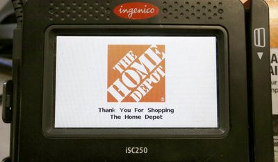 In this Wednesday, May 18, 2016, photo, the Home Depot logo appears on a credit card reader at a Home Depot store in Bellingham, Mass. The Home Depot Inc. says in a new federal lawsuit that Visa and MasterCard are using security measures prone to fraud, putting it and other retailers at risk of hacking attacks by cyber thieves. Atlanta-based Home Depot says new payment cards with so-called &amp;quot;chip&amp;quot; technology, rolled out in the U.S. in recent years, remain less secure than cards used in Europe and elsewhere in the world. (AP Photo/Steven Senne)