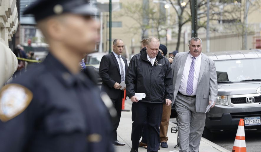 Police investigate after a 32-year-old woman suffered a gunshot wound to her ankle in Lower Manhattan in New York on Monday, April 24, 2017. Police say the victim was found in front of 17 Battery Place near Battery Park as officers were responding to report of an assault in progress. (AP Photo/Peter Morgan)