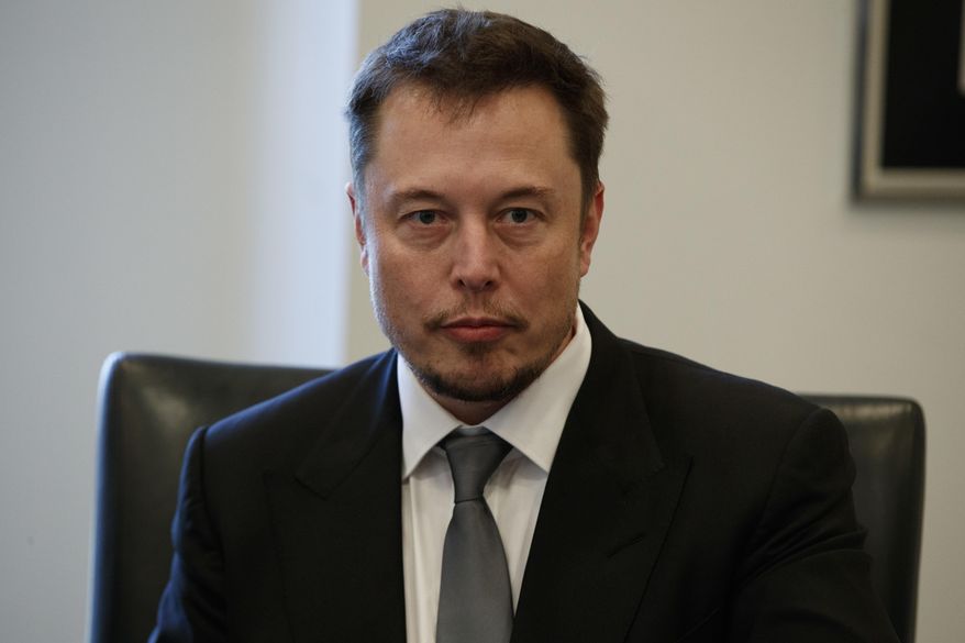 FILE - In this Dec. 14, 2016, file photo, Tesla CEO Elon Musk listens as President-elect Donald Trump speaks during a meeting with technology industry leaders at Trump Tower in New York., Musk was spotted spending time with actress Amber Heard in Australia on April 24, 2017, (AP Photo/Evan Vucci, File)