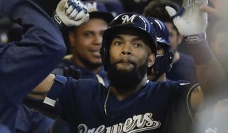 Milwaukee Brewers&#39; Eric Thames celebrates his two-run home run during the second inning of a baseball game against the Cincinnati Reds Monday, April 24, 2017, in Milwaukee. (AP Photo/Morry Gash)