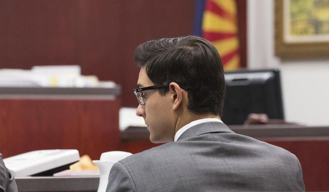 In this photo provided by Halie Chavez, Steven Jones listens to closing statements on Tuesday, April 25, 2017, in Flagstaff, Ariz. Closing arguments began Tuesday, April 25, in Jones' murder trial, who killed one student and wounded three others in what he said was self-defense after being punched in the face just a few weeks into his freshman year in October 2015. (Halie Chavez/The Lumberjack via AP)