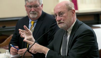 Natural Resources Secretary John Laird, right, discusses the damaged spillway on the Oroville Dam during a hearing of the Senate Committee on Natural Resources and Water, Tuesday, April 25, 2017, in Sacramento, Calif. Laird, and Bill Croyle, left, the acting director of the Department of Water Resources, updated lawmakers on the actions taken to repair the damaged spillway that caused the evacuation of nearly 200,000 people downstream of the Oroville Dam in February. (AP Photo/Rich Pedroncelli)