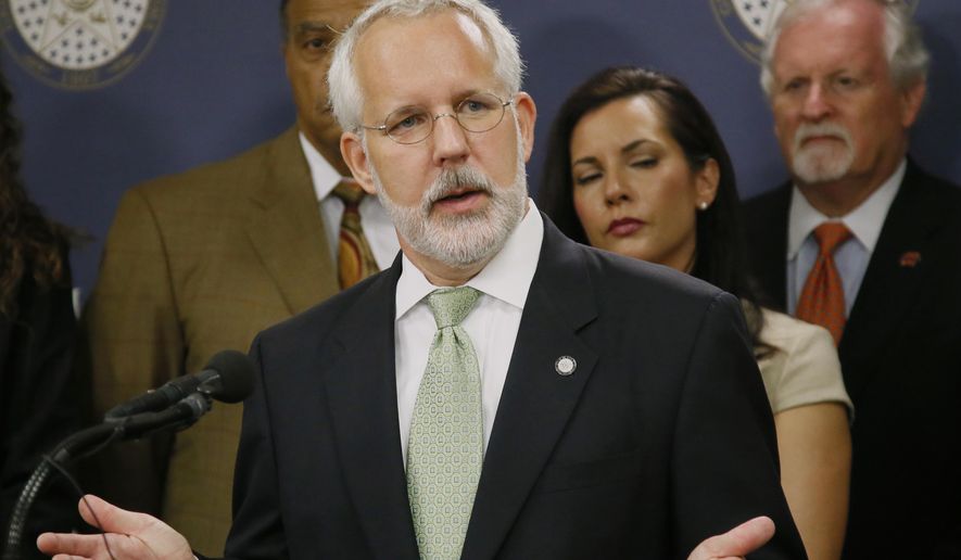 Former Oklahoma Gov. Brad Henry gestures as he answers a question during a news conference in Oklahoma City, Tuesday, April 25, 2017. Henry, one of the co-chairs of the Oklahoma Death Penalty Review Commission, announced the findings of a report that says the state should extend its moratorium on capital punishment. (AP Photo/Sue Ogrocki)
