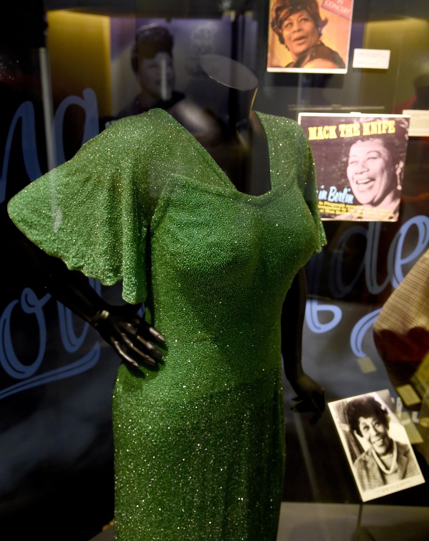 A dress worn by Ella Fitzgerald is displayed at a sneak preview of "Ella at 100: Celebrating the Artistry of Ella Fitzgerald" at The Grammy Museum at L.A. Live on Monday, April 24, 2017, in Los Angeles. (Photo by Chris Pizzello/Invision/AP)