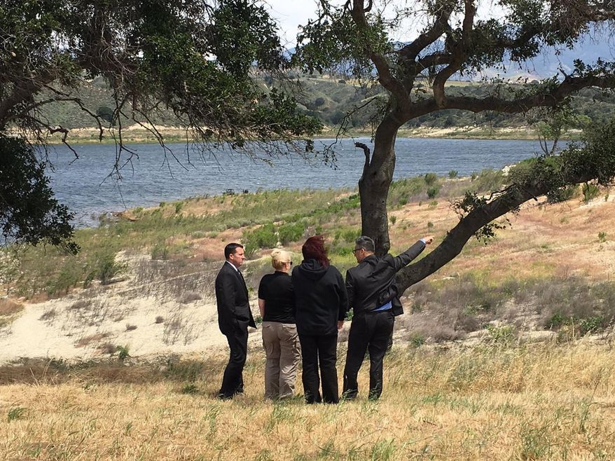In this photo released by Los Angeles Sheriff Department, homicide detectives continue their investigation at Lake Cachuma Recreation looking for missing 5-year-old boy, Andressian Aramazd Jr., in Santa Barbara County, Calif. Homicide detectives and police divers are searching the lake for a missing boy whose father was arrested after being found unconscious over the weekend at a Southern California park. (Los Angeles Sheriff Department via AP)