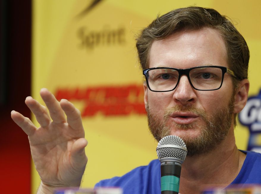 FILE - In this Oct. 30, 2016, file photo, Dale Earnhardt Jr., gestures during a press conference at Martinsville Speedway in Martinsville, Va. Hendrick Motorsports says Dale Earnhardt Jr. will retire at the end of this season. (AP Photo/Steve Helber, File)