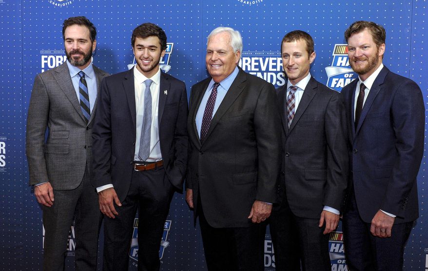 FILE - In this Jan. 20, 2017, file photo, NASCAR Hall of Fame inductee and team owner Rick Hendrick, center, poses with his drivers from left, Jimmie Johnson, Chase Elliott, Kasey Kahne, and Dale Earnhardt Jr. on the red carpet before the NASCAR Hall of Fame Induction ceremony in Charlotte, N.C. Hendrick Motorsports says Dale Earnhardt Jr. will retire at the end of this season. (AP Photo/Mike McCarn, File)