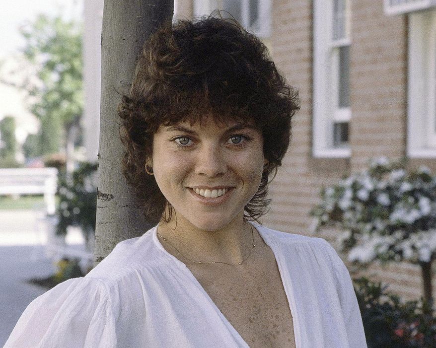 FILE - This Feb. 19, 1982 file photo shows actress Erin Moran of the television show, "Happy Days" in Los Angeles. Moran, the former child star who played Joanie Cunningham in the sitcoms "Happy Days" and "Joanie Loves Chachi," died Saturday, April 22, 2017, at 56. Police in Harrison County, Indiana said that she was found unresponsive after authorities received a 911 call. (AP Photo/Wally Fong, File)