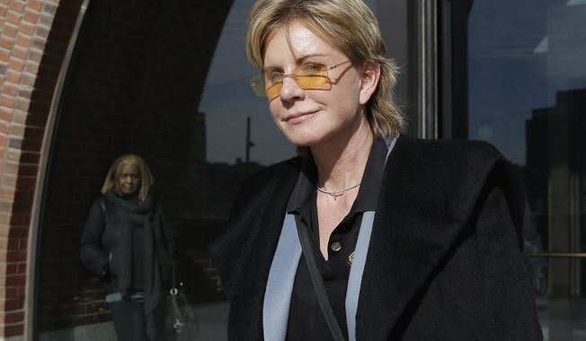 FILE - In a Feb. 7, 2013, file photo, author Patricia Cornwell leaves federal court in Boston after she took the stand in her lawsuit against her former financial management company. Media outlets report that Cornwell visited the department Monday, April 24, 2017, and paid the costs for an entire weeklong course on gunshot restoration, worth an estimated $20,000. The purpose of the donation is philanthropic, but Cornwell said she also intends to observe the course as part of research for her next novel. (AP Photo/Steven Senne, File)