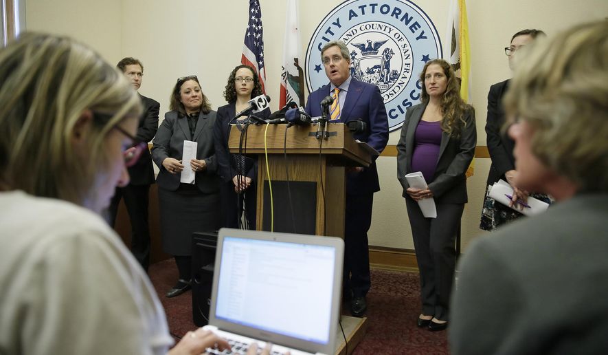 City Attorney Dennis Herrera, at podium, with his staff beside him, talks about a federal judge&#39;s order blocking any attempt by the Trump administration to withhold money from &amp;quot;sanctuary cities&amp;quot; during a news conference at City Hall Tuesday, April 25, 2017, in San Francisco. A federal judge on Tuesday said the president has no authority to attach new conditions to federal spending. U.S. District Judge William Orrick issued the preliminary injunction in two lawsuits, one brought by the city of San Francisco, the other by Santa Clara County, against an executive order targeting communities that protect immigrants from deportation. (AP Photo/Eric Risberg)